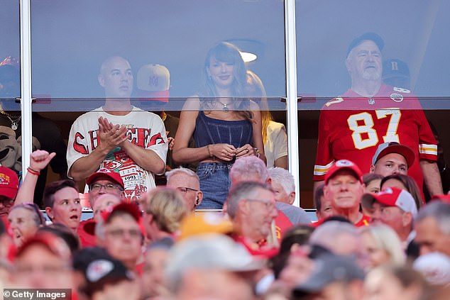 Swift watched the game alongside her boyfriend's father, Ed (right), in a private suite.