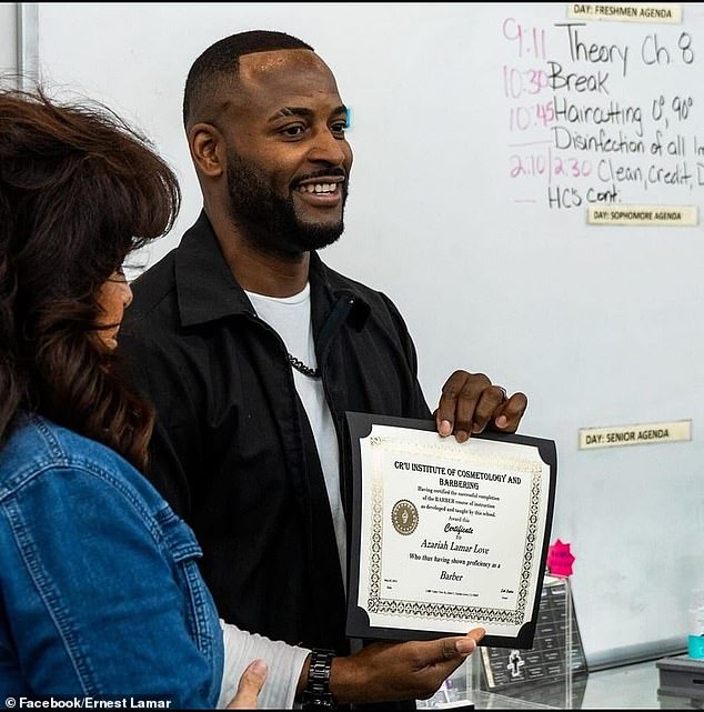 Love is pictured holding his barber certificate in May. At the time, he said he was getting better and added that he does everything for his children.