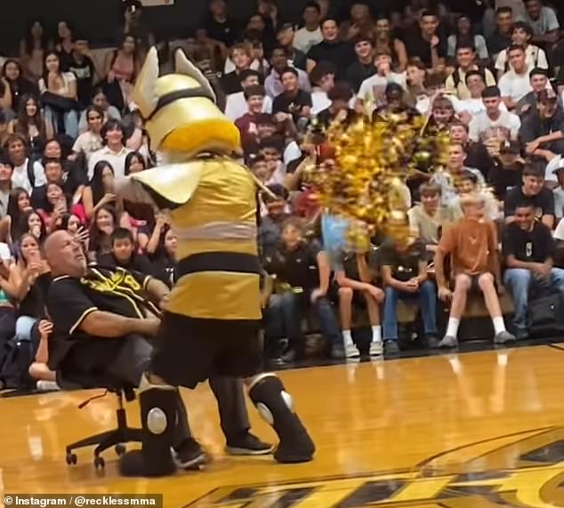 The video, posted on social media, shows Robert Nunes of Buhach Colony High School sliding around in an office chair as the school mascot walks toward him at a back-to-school rally.