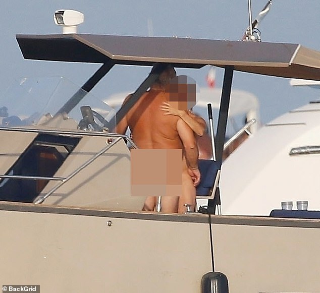 While Ronaldo and Georgina were showing affection, a completely naked couple sailed by on their boat.