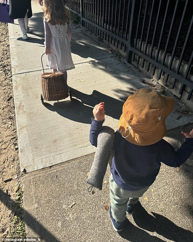 Alongside a photo of her two-year-old son, Tom, carrying a snake-shaped door draught stopper as he walked to a local park, Edwina wrote some heartfelt words.