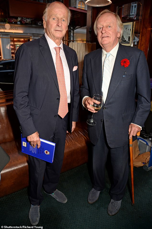 Andrew poses with his brother Simon as they attend the launch celebration for Tom's new book.