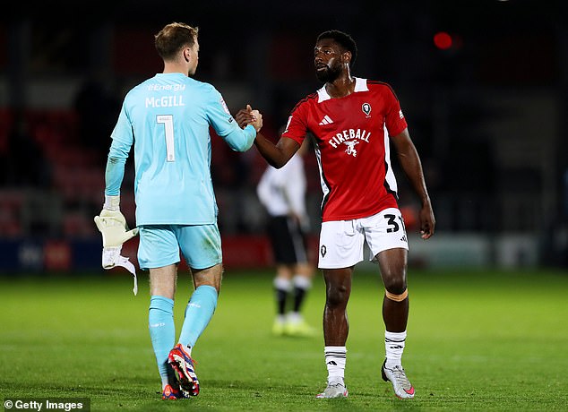 Keane complained about the number of touches Gill (left) was taking as MK Dons searched for a comeback goal in their League Two clash with Salford City on Monday night.