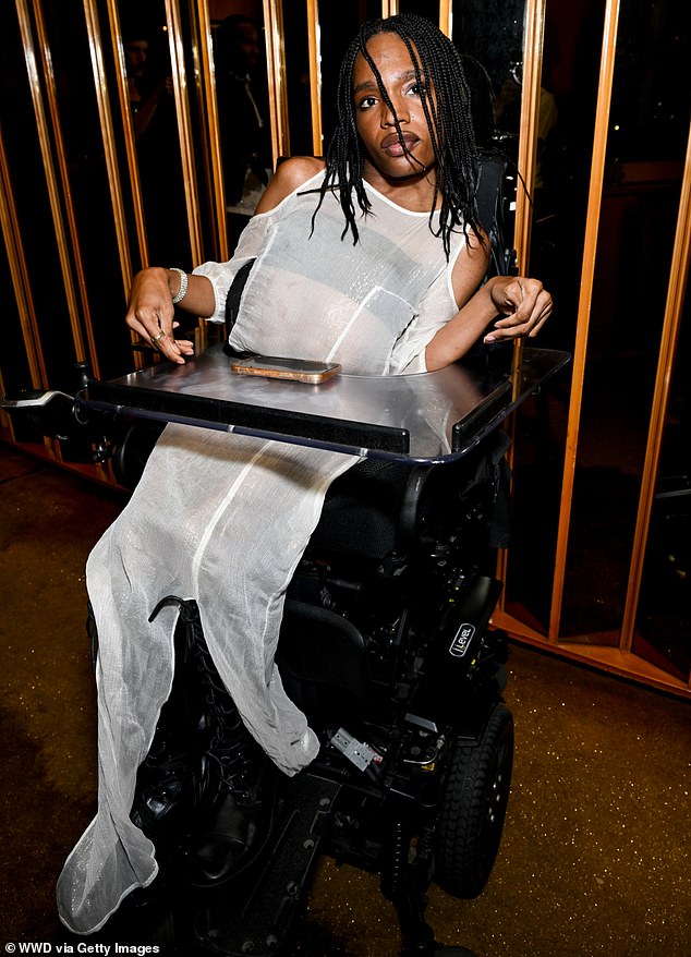 American model Aaron Rose Philip, 23, the first black, transgender and disabled model to be represented by a major agency, looked lovely in a sheer white dress.