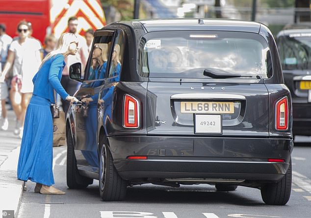 After leaving the store, Gabriella hailed a black cab on the main street.