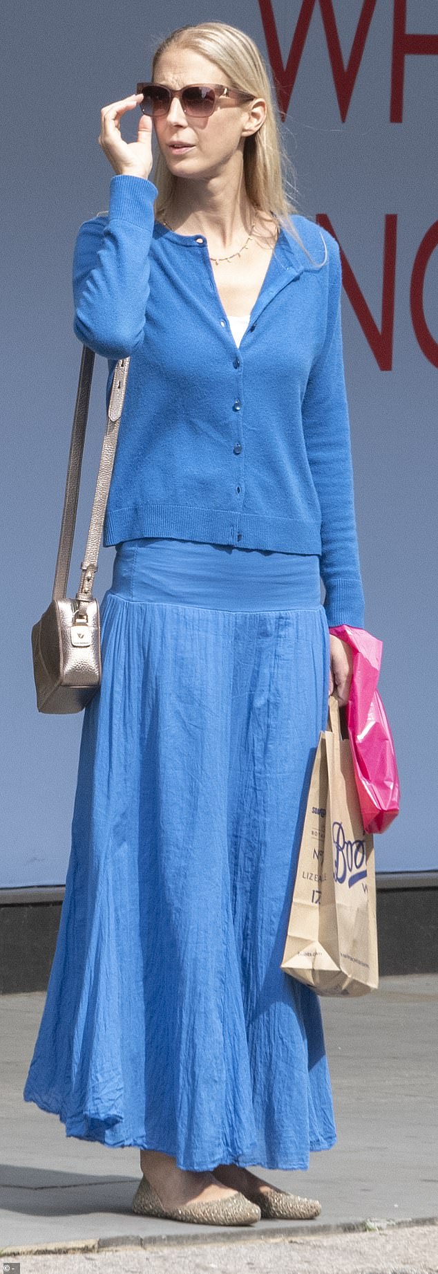 The royal channeled summer in a colorful all-blue ensemble, pairing a button-down cardigan and matching cotton maxi skirt.