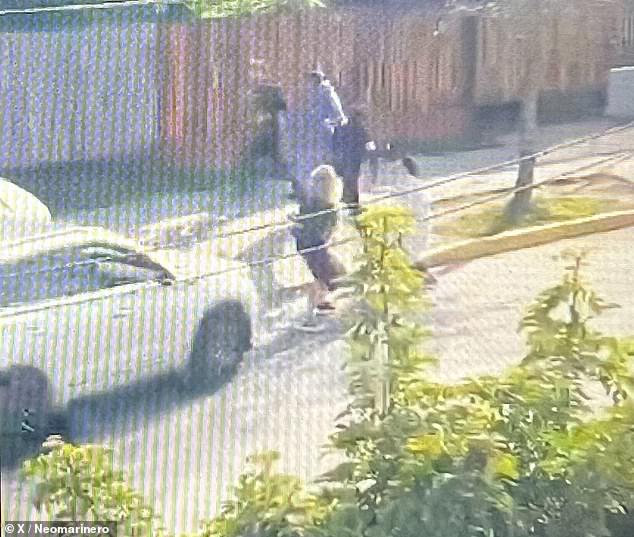 A still image from a video showed a pickup truck driven by a boy nearly running over his mother before hitting the father, a student he had been fighting with at a school in Puente Alto, Chile, on Thursday.