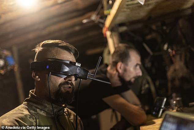 Ukrainian soldiers fly an FPV drone in the direction of Kreminna, Luhansk Oblast, Ukraine, August 25, 2024