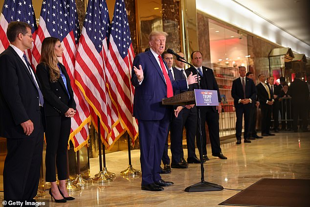 Trump stood with his legal team in the lobby of Trump Tower on Friday before heading to North Carolina for a campaign event.