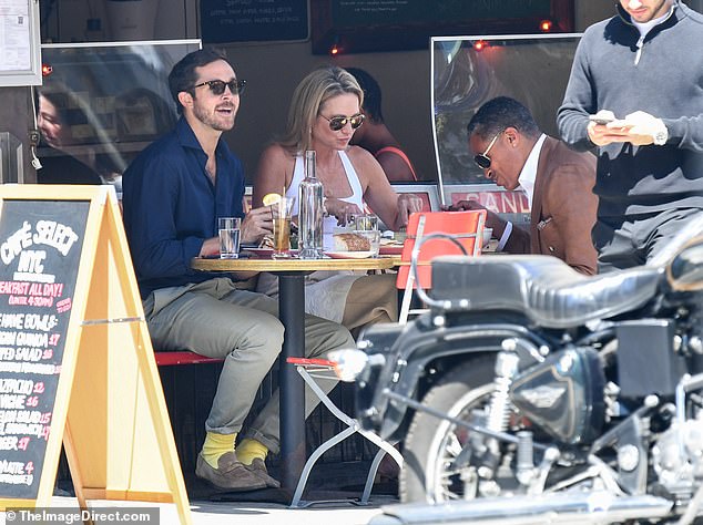 Exclusive photos show the trio chatting and laughing as they enjoyed food and drinks al fresco at trendy Café Select in Soho.