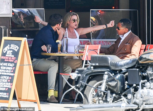 Amy, 51, who was sitting between her boyfriend, 47, and Tyson, 34, at one point appeared very animated during the conversation, gesturing dramatically and bursting into laughter.