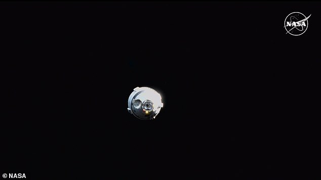 The capsule, seen in a NASA livestream Friday night, suffered problems with its thrusters and helium leaks.