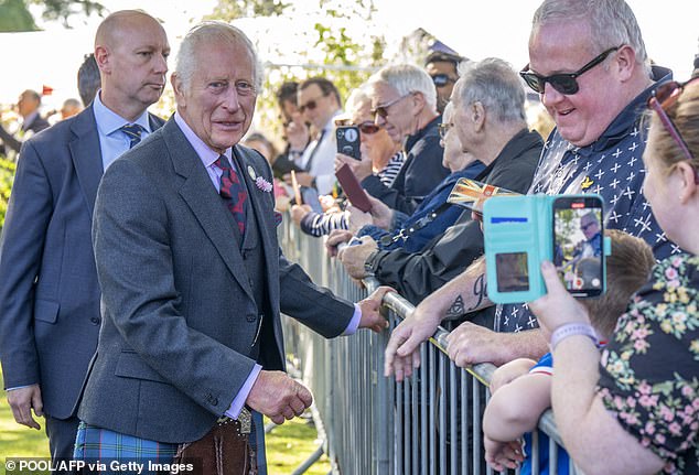 Britain's King Charles III meets members of the public during a visit to the Royal Horticultural Society's 200th Flower Show in Aberdeen on August 31.