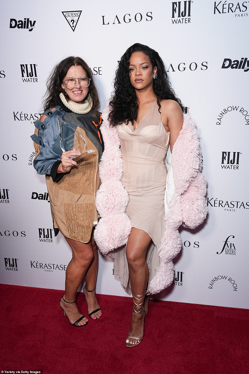 The Rude Boy singer stunned in a daring sheer halterneck bustier-style dress at the event, held at The Rainbow Room atop 30 Rockefeller Plaza; pictured with Katie Grand