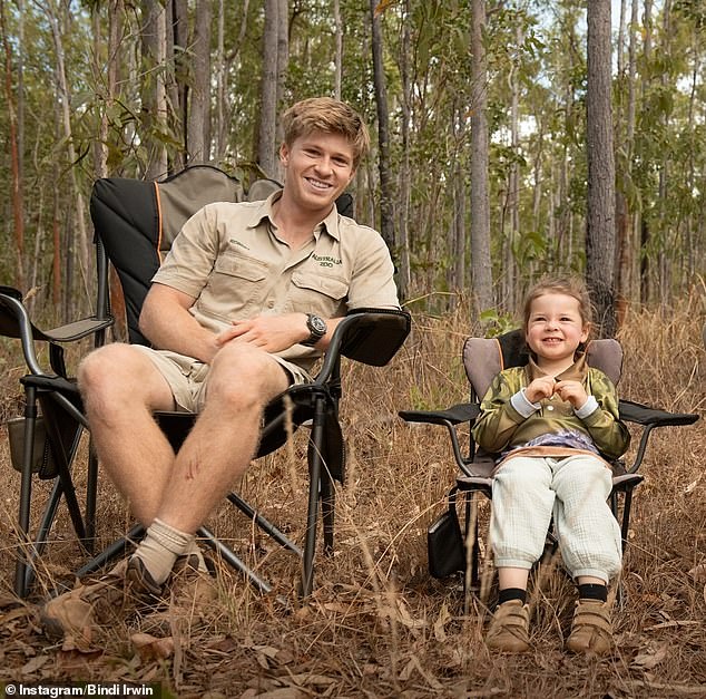 Robert couldn't wipe the smile off his face as he cheekily clowned around in front of the camera alongside young Grace.