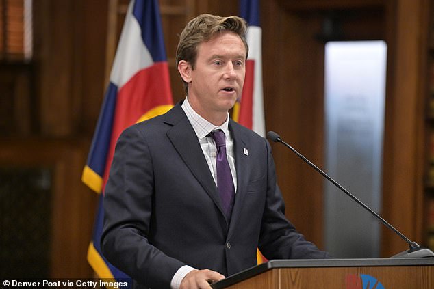 The currently vacant building in Denver is currently an option and is being considered by the city's Democratic mayor, Mike Johnston, pictured above.