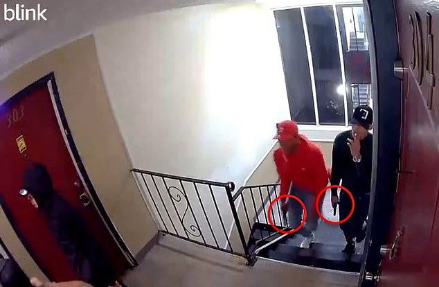 In one video, other gang members run up the stairs, carrying guns. In the background, the men can be heard speaking Spanish to each other.