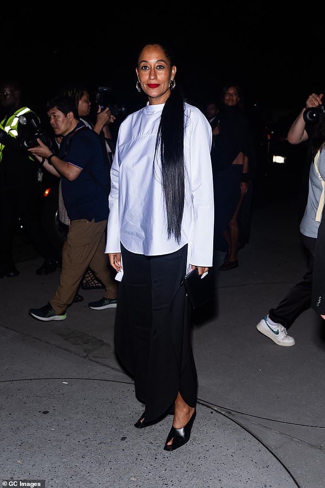 Tracee Ellis Ross, 51, opted for a white blouse, a long black skirt and black open-toed heels.