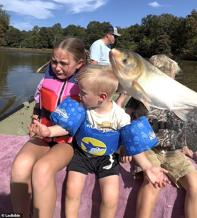 This is the moment the fish hit Henry in the face.