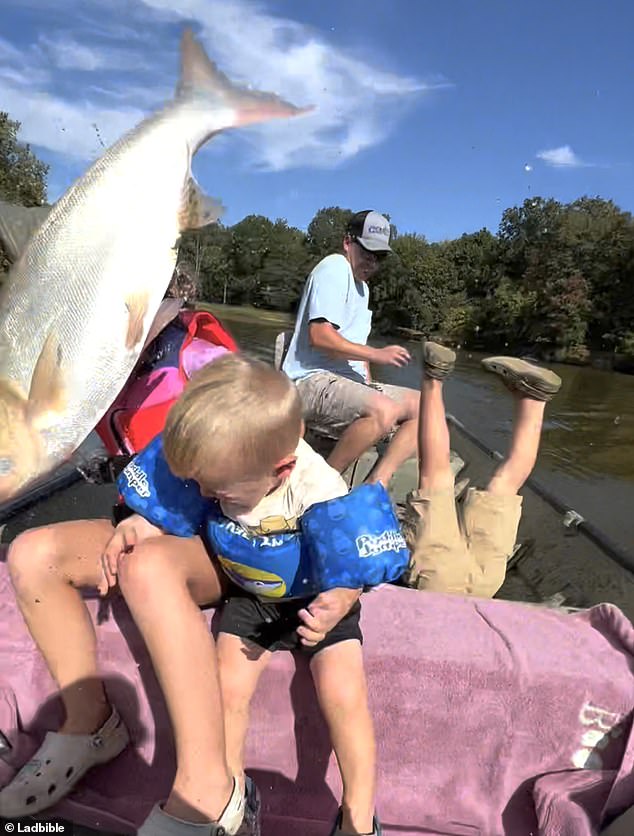 The fish knocked Henry completely backwards, leaving his feet dangling in the air.