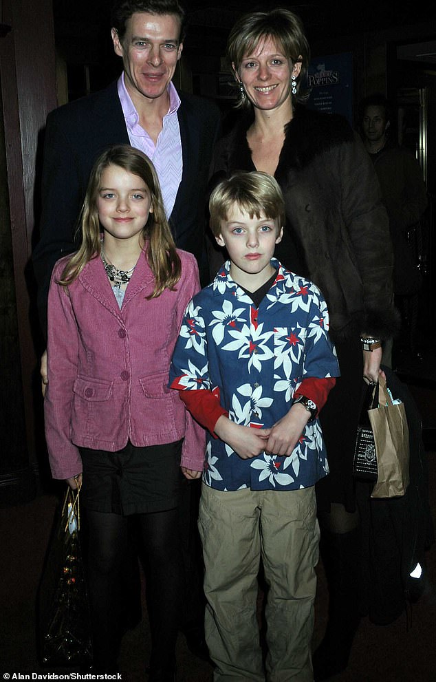 Alexander with his sister Flora and his parents James and Julia Ogilvy in 2004