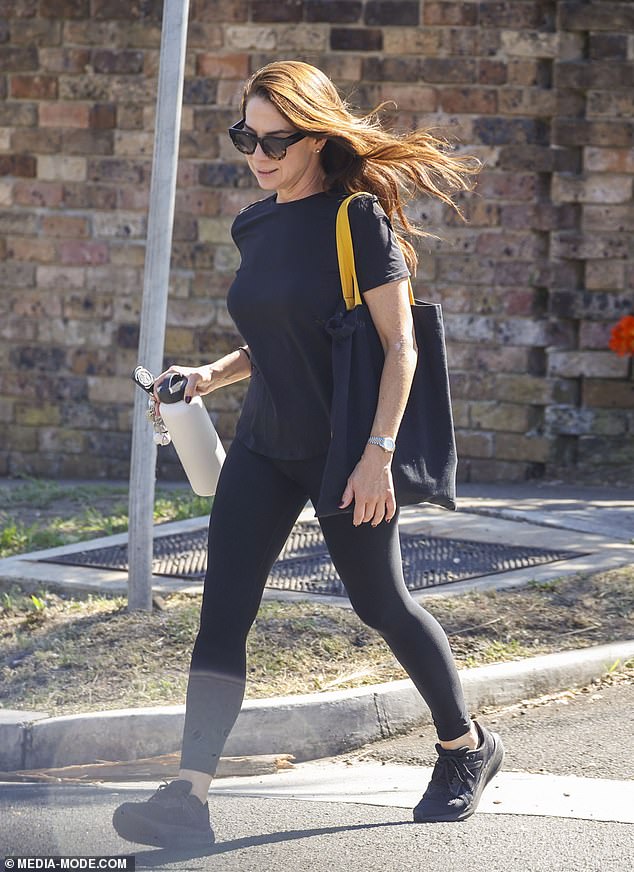 The Nova radio star appeared to be wearing minimal makeup and a pair of sunglasses as she wore her brunette locks loose over her shoulders. Kate completed her ensemble with a pair of black sneakers and a few accessories.