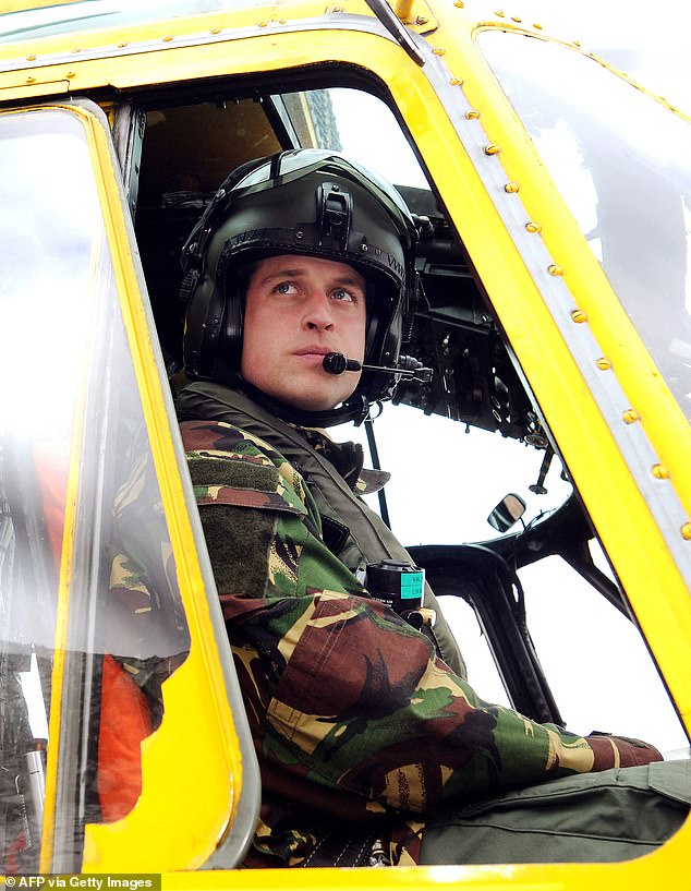 William is pictured sitting at the controls of a Sea King helicopter during a training exercise in March 2011.