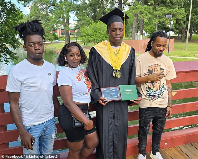 Jezavion (left) at his younger brother Keshoan's high school graduation, along with his older brother Daveon (right) and their mother Lakisha Whitaker.