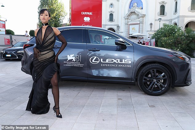 Taylor also posed off the carpet when she was seen standing outside a Lexus car.