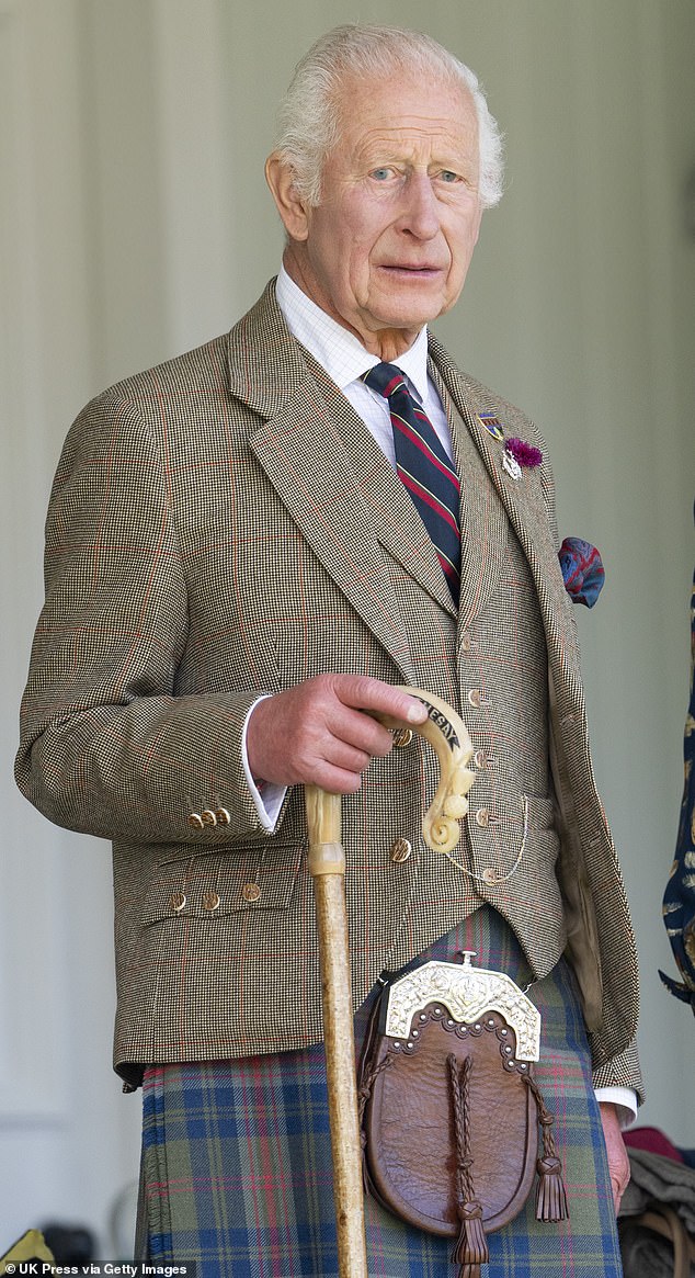 The king wore a Scottish jacket and a navy blue, red and green kilt.