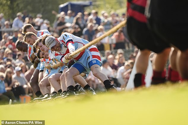 Competitors take part in tug-of-war during the Braemar Gathering Highland Games