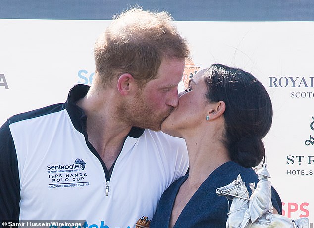 The Duke and Duchess of Sussex kiss during the Sentebale Polo Awards Ceremony at the Royal County of Berkshire Polo Club on July 26, 2018 in Windsor, England.