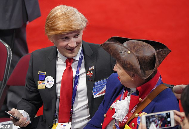 Massachusetts delegate Jimmy Davidson wears a Donald Trump-style wig at the 2016 Republican National Convention