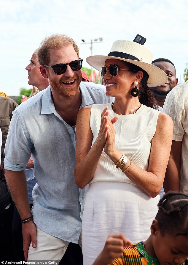 Harry was given entirely taxpayer-funded protection before stepping down as a working royal and moving to Montecito, California, with Meghan Markle (pictured, in San Basilio de Palenque)