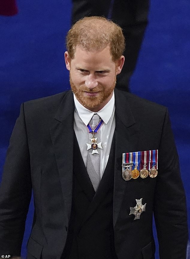 A source said Harry's (pictured at the coronation of King Charles III) reported refusal to drop the legal case risks undermining a potential reconciliation with his father.