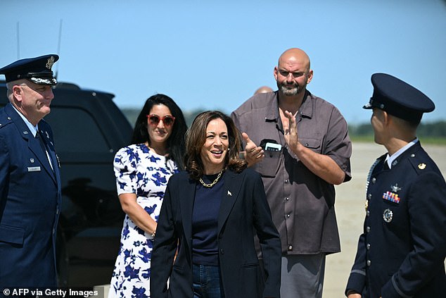 Kamala Harris was greeted by Senator John Fetterman and his wife Gisele Barreto Fetterman at the Pittsburgh airport on Friday