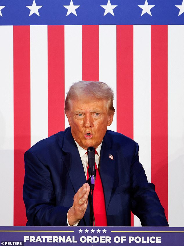 Donald Trump gestures as he addresses the Fraternal Order of Police at their meeting in Charlotte, North Carolina, on Friday.