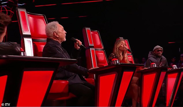 The ITV talent show's judges were also thrilled with Will.i.am, 49 (right), who looked serious as he looked at the two music legends.