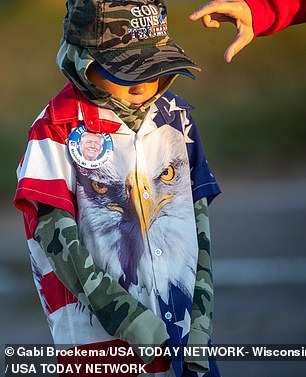 Many were bundled up on a cold Wisconsin day, but the sun beat down on the airport tarmac as the Republican candidate spoke for more than 90 minutes.