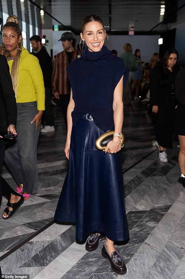 Olivia Palermo also turned heads in a sleeveless navy knit top and long faux leather skirt.