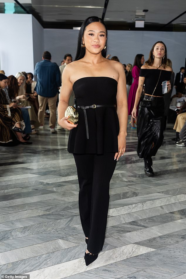 Olympic gold medalist Suni Lee put on a chic display in a flowy strapless top paired with black trousers.