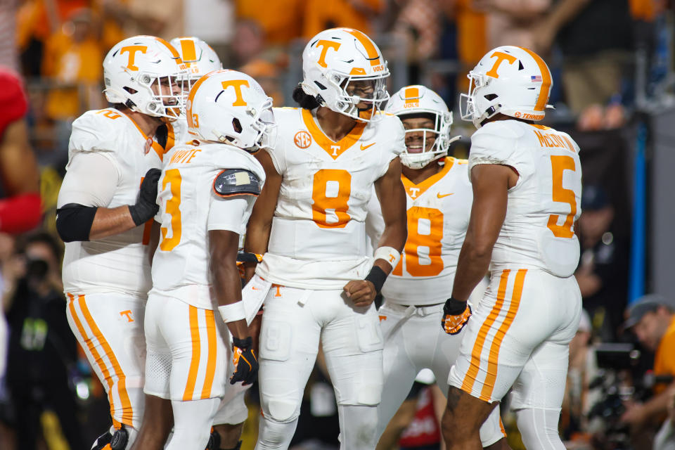 Tennessee quarterback Nico Iamaleava (8) celebrates with his team after scoring a touchdown during their win over NC State. (Nicholas Faulkner/Getty Images)