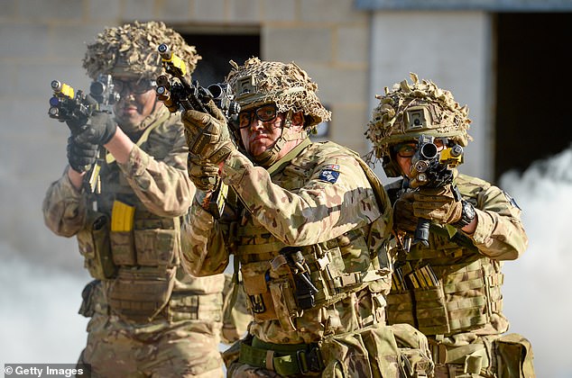 It comes amid a move to use better technology and artificial intelligence to prepare for complex future warfare. Pictured: Soldiers in Salisbury demonstrate the EXO Insight glasses, which are a virtual eye-tracking behaviour monitoring system