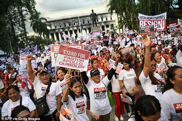 Supporters of Apollo Quiboloy hold a prayer rally at a park in Manila on March 4, 2024