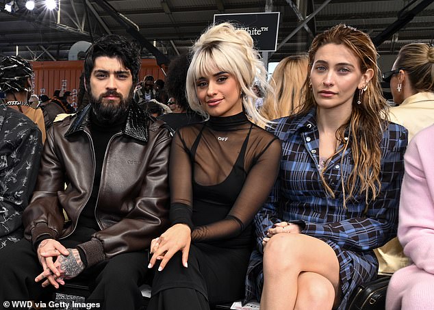 Zayn was in famous company for the Off-White show in New York on Saturday, where he turned out in a brown leather jacket with a faux crocodile-print patent leather collar.