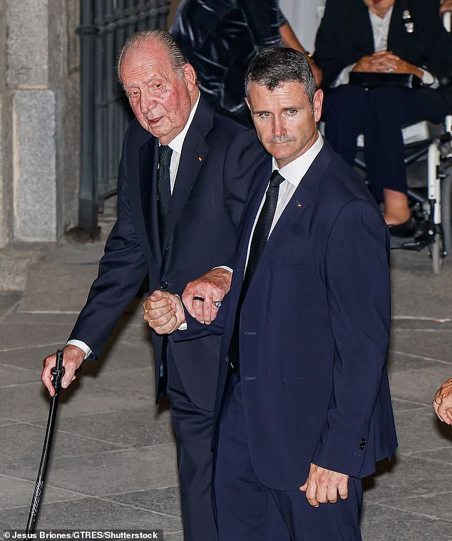 King Juan Carlos I used a cane and was supported as he entered the cathedral.