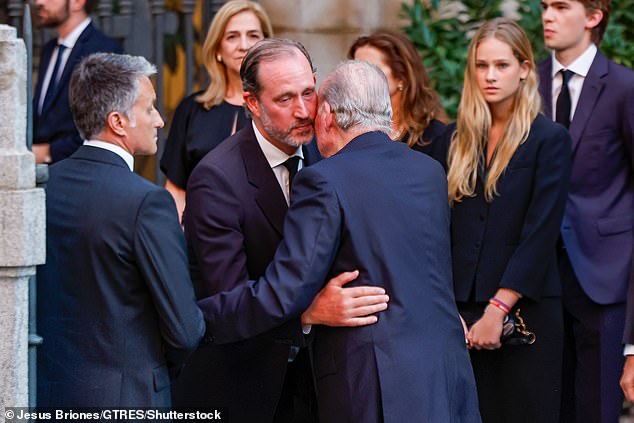 King Juan Carlos I was photographed greeting another mourner at his nephew's funeral