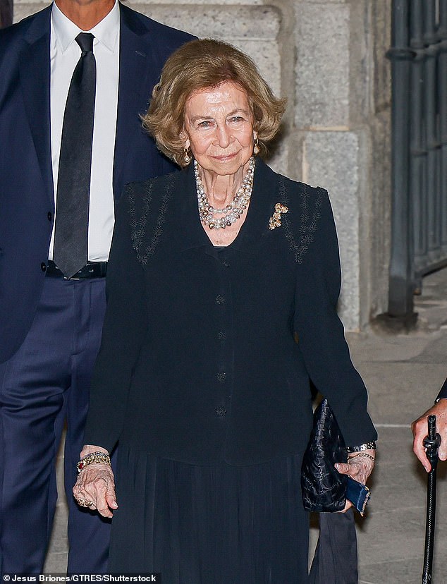 Queen Sofia of Spain complemented her black outfit with three strands of pearls and numerous bracelets.