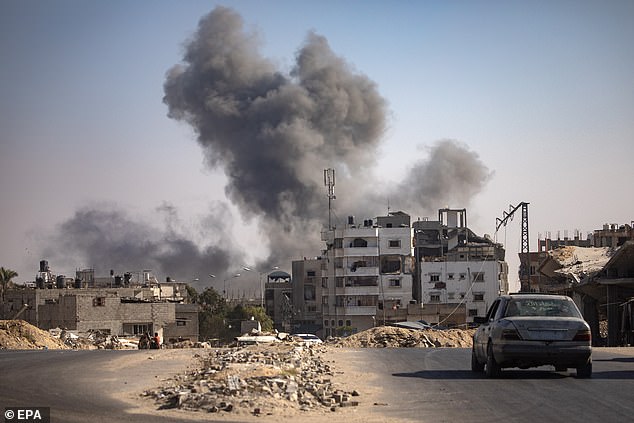 The rare attack at the Allenby Bridge crossing comes amid rising violence in the West Bank with major Israeli incursions and attacks by Palestinians (pictured: Smoke rises after an Israeli airstrike in Khan Younis in the southern Gaza Strip)