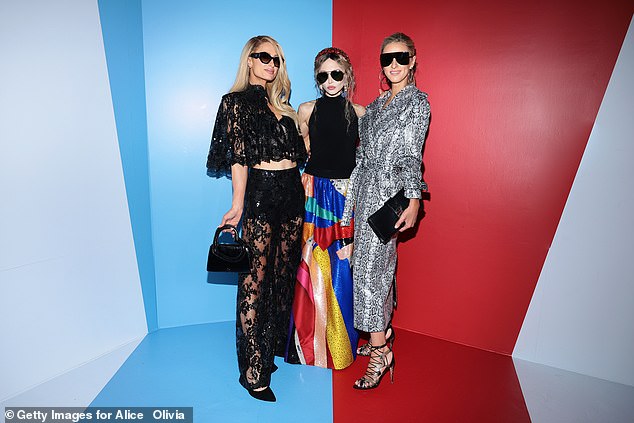 Paris, Stacey Bendet and Nick posed together at the Alice + Olivia fashion show